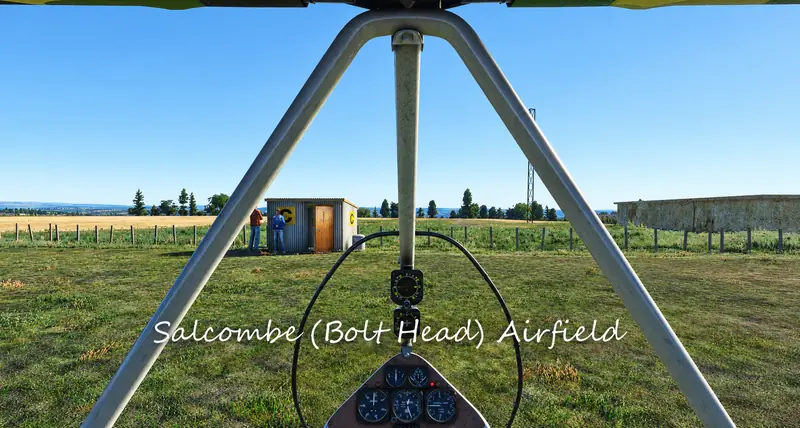 Microlight cockpit view of the hut and fence at Salcombe (Bolt Head) Airfield in Microsoft Flight Simulator