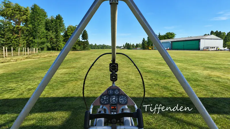 Flex-wing microlight cockpit view down the grass runway at Tiffenden in Microsoft Flight Simulator